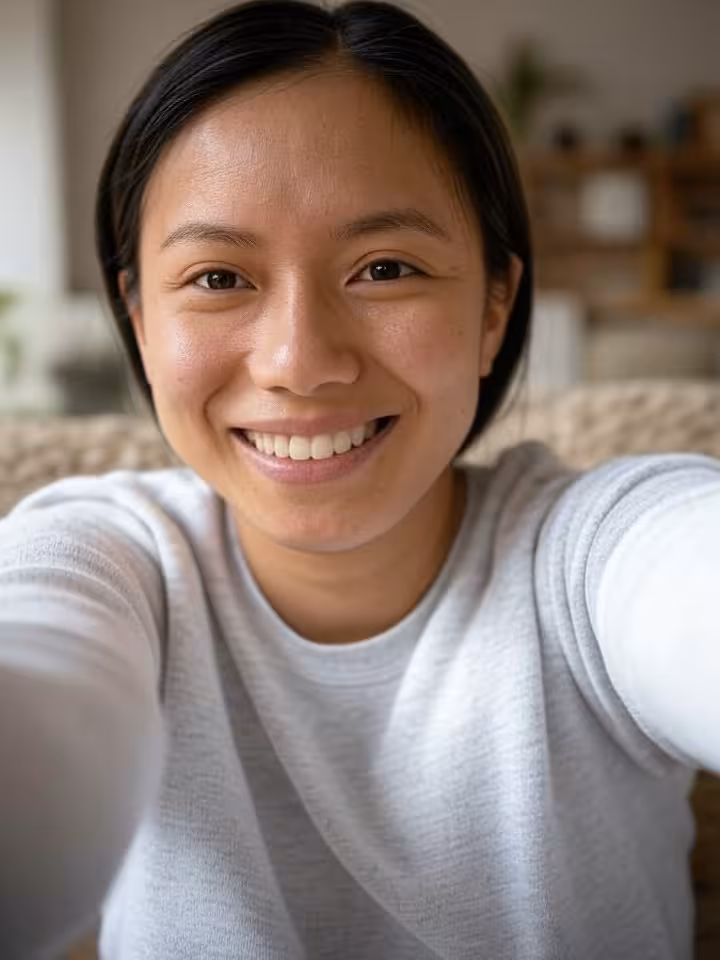 Gender fluid person taking authentic selfie for dating profile, natural lighting, casual comfortable