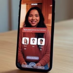 Close-up of smartphone screen displaying Hinge dating app profile with creative text prompts and col